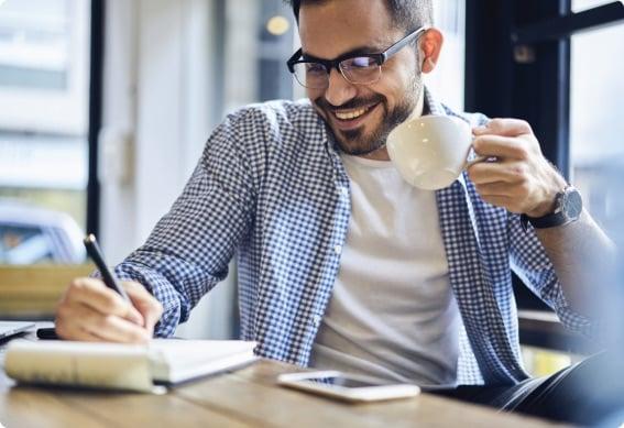 a man holding a cup