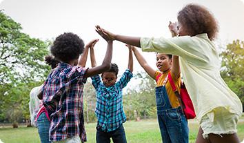 a group of people holding hands