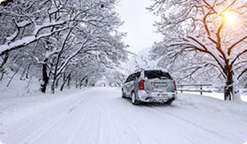 a car driving on a snowy road