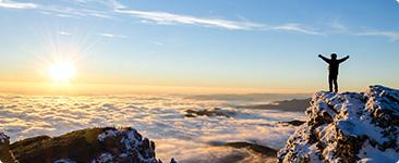 a person standing on a mountain