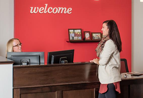 A customer chatting at a desk