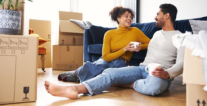 a man and a woman sitting on the floor