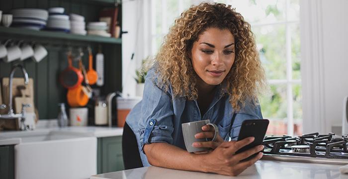 a woman holding a phone